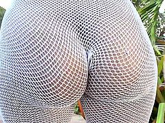 Magnificent whore Ana is wearing her fishnet to look more sexier that she already is and is masturbating her trimmed and wet pussy with a big dildo somewhere outdoor on fresh air.