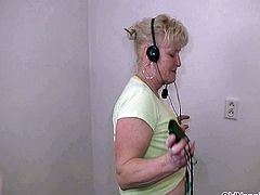 Blonde granny with big tits dances naked