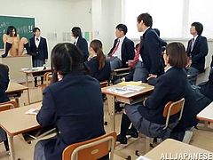 Sweet Japanese girl in school uniform gets punished. She has to take her clothes off and show her perky tits to the whole class.