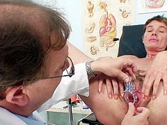 Filthy short-haired brunette mom goes through a thorough medical examination while a kinky doctor examines her twat with speculum before he sticks dildo inside to drill it with pressure.