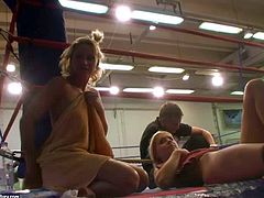 Attractive blonde hotties Kathia Nobili and Brandy Smile with delicious asses and natural boobs get naked during rough fight and start licking each other on the floor in ring