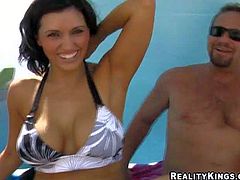 Dark haired woman in black and white bikini gets picked up by MILF Hunter on the beach. They have a great time together. He touches her boobs in public place curiously. Watch her get seduced!