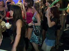 These are nasty girls who are going wild and dirty in a club. One of the chicks unbuttons her blouse flashing her tits. Then, she kisses passionately with another girl. Later, she blows meaty cock.