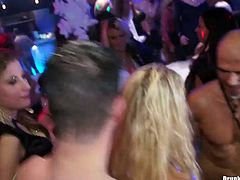 Spoiled half-naked drunk chics kneel down in front of horny dudes in order to oral fuck their sturdy cocks while other sluts enjoy dancing during an insane group sex party by Tainster.
