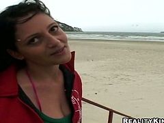 This brunette is all natural. Kinky nympho likes wandering along the beach. Horn-mad slut smiles when spoiled dude offers her to pose on cam. Bitchie slim nympho jams her tits, turns and shows pale ass proudly right outdoors.