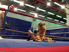 Naked blonde babes Laura Crystal and Michele Moist with perfectly shaped body figures and nice natural hooters get filmed by dirty referee during amazing chick fight in the ring
