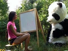 Slutty teen gets nailed by panda bear in outdoor porn session