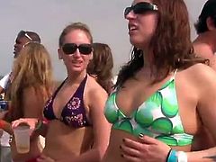 Bikini ladies have fun on the beach