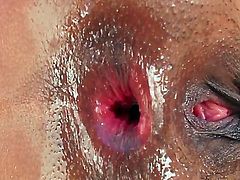 Slutty busty black bitch Evanni Solei gets oiled up and ready to be fucked in her tight ass