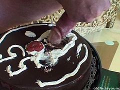 Skinny cheap looking blond amateur covers a meety small dick of horny daddy with a cream from a cake before she sucks it with pleasure.