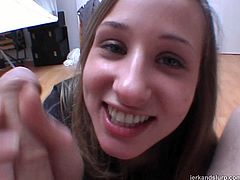 When she is presented with her horny friend's prick she can't resist trying it out. She gets down on her knees to give him a qualified handjob.