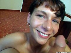 When it comes to cocks that babe is a real pro! She is horny and willing to do whatever it takes to make her lover stay at home. So she gets down on her knees to give him a nice handjob.