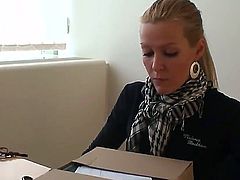 Stunning and gorgeous blonde pornstar babe Sophie Moone enjoys in getting her hands on all those nasty presents she got and enjoys in unwrapping them with pleasure behind the desk