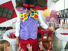 These two redhead girls are excited to see a joker. He brought a gift, but first they have to make some naughty moves, which will give the joker guy a boner. Soon enough he reveals his huge man meat right under his pants. Сuties grab his throbbing pole and suck it up and down all over.