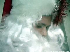 This extremely perverted brunette hottie is so horny that she can't stop sucking Santa's cock. She sucks it with all the passion she has and then he fucks her from behind.