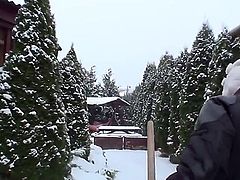 Pretty blonde babe Kathia Nobili with beautiful blue eyes and nice body figure in black warm outfit gets filmed while cleaning snow and having some fun on a winter day.