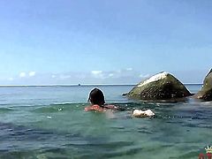 Provocative nude teen with very long hair and delicious round ass teases and polishes her shaved fish lips to orgasm in the beach while dirty dude films her in pov.