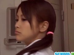 Watch a cute Japanese brunette schoolgirl getting banged from both ends into ecstasy in the locker room.