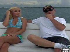 Aroused and hot looking tanned blonde in sexy lingerie enjoys in giving Jay a hot head while sitting on his boat and pleases him really good in front of the cam