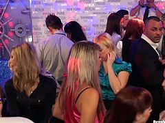 Fuckable white milfs in steamy office wear and pantyhose dance seductively in the middle of dance floor rubbing over each other and over kinky dudes in group sex video by Tainster.