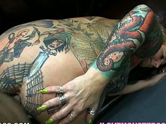 Nasty MILF with huge boobs shows her tattooed body. She gives a titjob and also sucks a cock. After that she gets fucked and facialed in POV video.