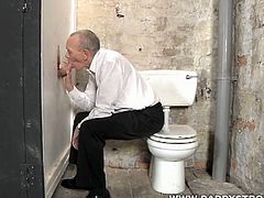 Take a look at this mature daddy sucking on a big shaft in the gloryhole. He is super cock hungry and just can't get enough of this hot rod!