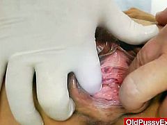 This blonde mom has her old pussy examined by her gyno. He inserts a speculum and he gives her a dildo to pleasure herself.