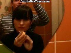 This brunette is at the mall with a guy. They go to the toilet together and end up fucking hardcore from behind.