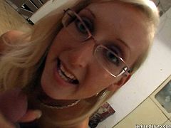 Four eyed blonde slut in sexy white stockings knows how to make her friend happy. She gets down on her knees and starts to jerk his cock.