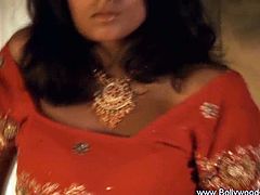 Check out this hot bollywood girl showing off her amazing body. She got super sexy moves and is dancing with a huge snake!