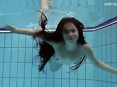 Long hair brunette teen with small tits swims