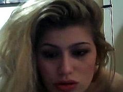 Blonde with a plate on the teeth communicates via webcam