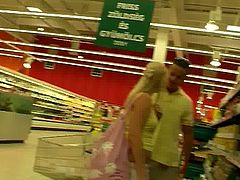 Sex hungry beefy dude picks up a curvy blond MILF in grocery store. He lures her home where he starts mauling her big slack tits from behind before she kneels down to oral fuck his sturdy penis.