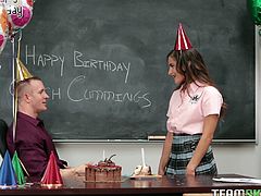 She is a naughty schoolgirl and that's why she has decided to give her teacher a surprise on his birthday. She steps in front of him & makes dirty posses to seduce him. Then he takes the full advantage of her by rubbing her pussy. He fucks her hard on desk from behind & gets a mouthful blowjob in return.