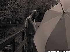 Kinky brunette presented in Beauty And The Senior sex clip will impress you with her dick sucking skills. Wonderful slender cutie with sweet tits and rounded butt provides old fat man with a blowjob right on the bridge in the park.