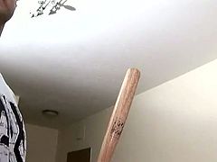 Frisky red haired bitch shows off her tits and butt and sucks baseball bat