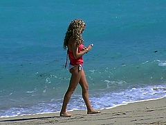 Playful curly blond chic takes a walk at the beach in steamy bikini. Later she shows off her big firm tits that will definitely drive you crazy in sultry sex video by Pornstar.