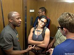 This hottie enters the elevator where all this guy silently admire her. She looks fucking hot and one of them can't help it anymore and grabs the bitch my her neck. Soon all of the dudes get wild with the brunette and she finds herself on her knees.