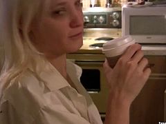 Kinky blonde chick with perky small tits is having coffee in the kitchen. Then she cooks for her BF wearing his shirt. Homemade video.
