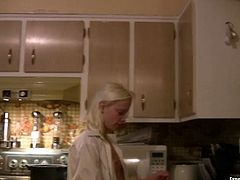 Kinky blonde chick with perky small tits is having coffee in the kitchen. Then she cooks for her BF wearing his shirt. Homemade video.