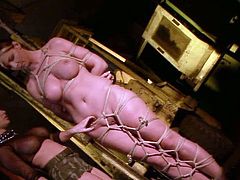 This poor nymph is all tied up and at mercy of her cruel mistress who is in the disciplinary mood. She clamps clothespins on slave's tongue and nipples. Then she whips her fine ass hard until it turns scarlet red.