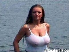 This video's definitely going to give you a boner as you have a look at this babe's amazing large tits as she takes a dip in the river.