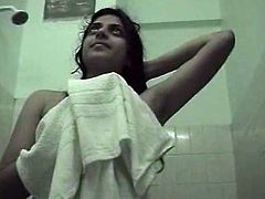 Kinky amateur Indian brunette takes a shower on cam. She shows her big ass and plays with natural tits. Then spoiled black head grabs the towel as if she gets shamed.