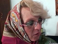 Granny in glasses gives young cock a BJ
