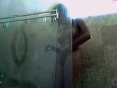 Brunette masturbating in shower