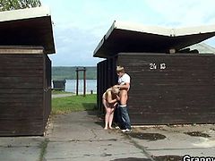 Watch a vicious blonde milf stripping off in public before giving a young stud a hell of a blowjob. Then they go into the restroom so he can bang her shaved clam into heaven.