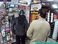 Kinky and hilarious brunette is in the sex shop. Spoiled svelte gal with natural tits wanders with some dudes in the shop with the hope to win their strong dicks for hot sex.