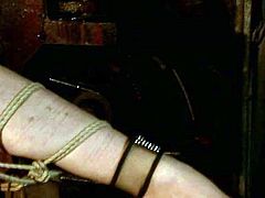 Sophisticated brunette domina in steamy fishnet tank bandages a flamboyant red-haired MILF before she forces her to suck a dildo, which she later uses to poke her cunt in BDSM-involved sex video by 21 Sextury.