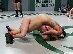 These girls fight for a while and then the losing girls get their pussies toyed and fingered right in a ring on the eyes of a audience.