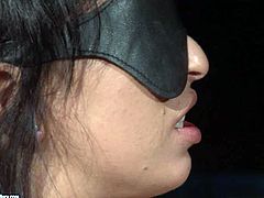 Dirty-minded pale brunette is fond of bondage. So she gets blindfolded and tied up at once. Horny dude fingers her pussy, pins it with metal clothes pegs and then fucks hard in a standing position.